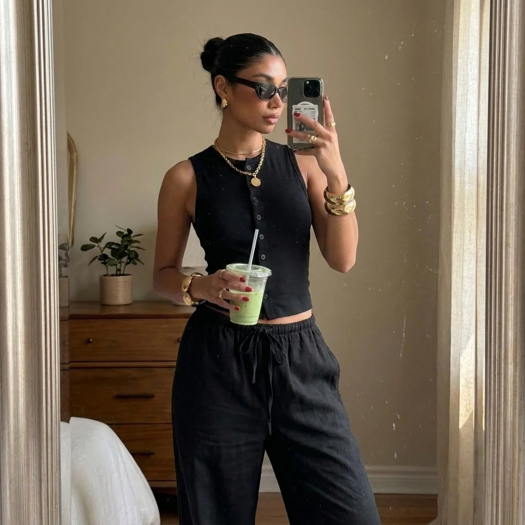 Mirror selfie showing the Classic Black Lunelle set and drawstring waist