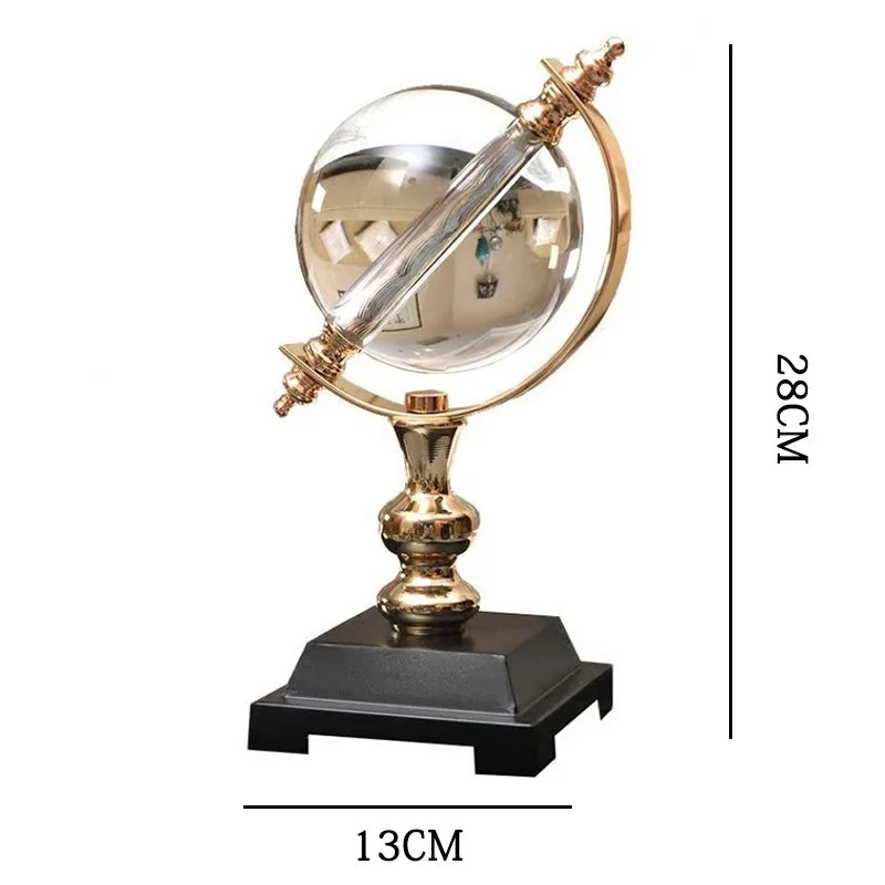 Clear decorative globe on a gold-coloured stand and black base, with a diagram showing its 28 cm height