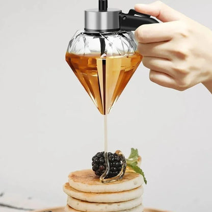 Glass honey dispenser with stainless steel base – view 2