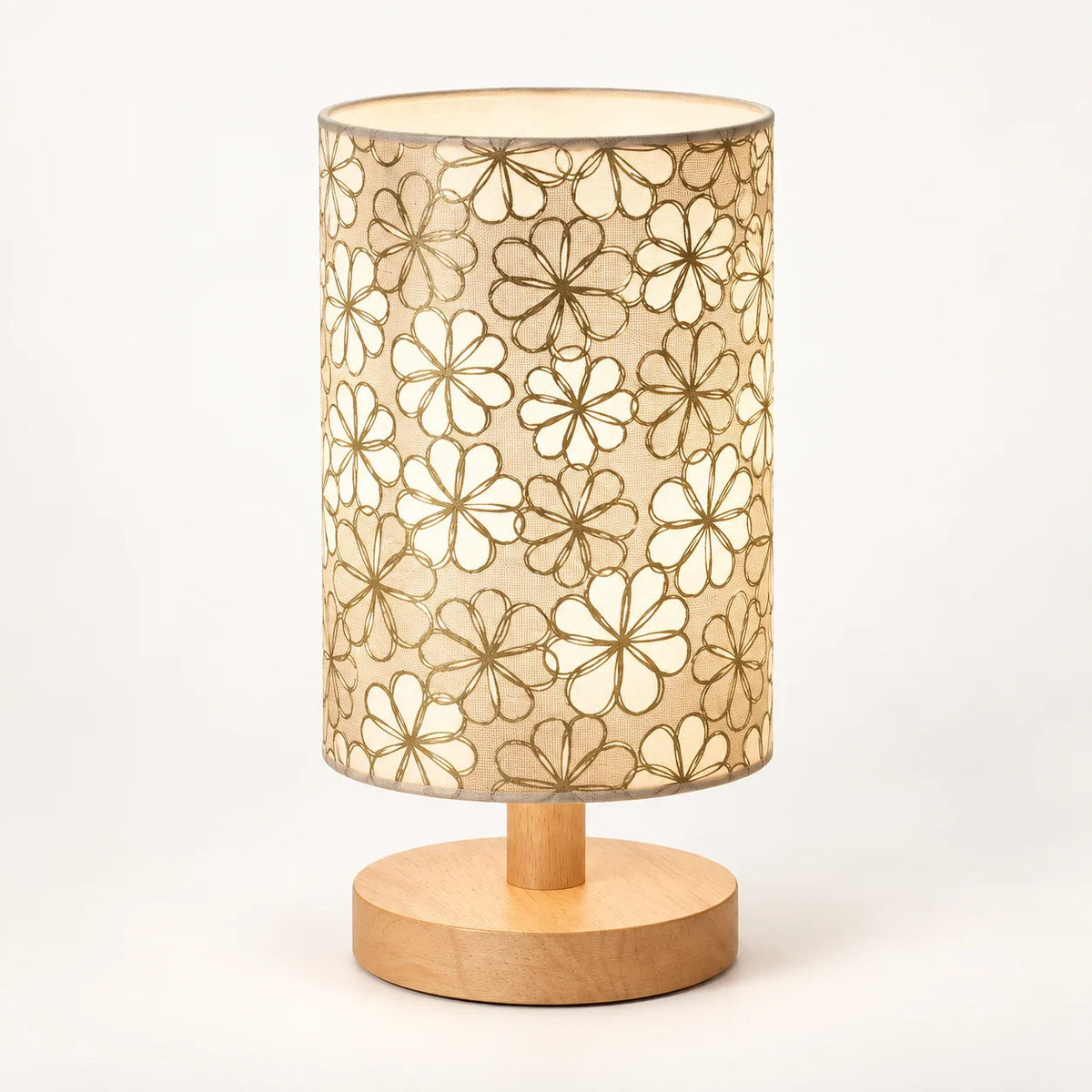 Decorative floral table lamp creating cosy warm bedside lighting