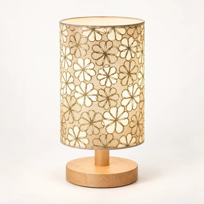 Decorative floral table lamp creating cosy warm bedside lighting