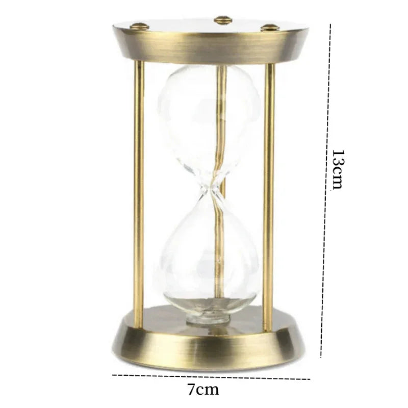 Gold metal hourglass dimension diagram labelled 13 cm high and 7 cm across the base.