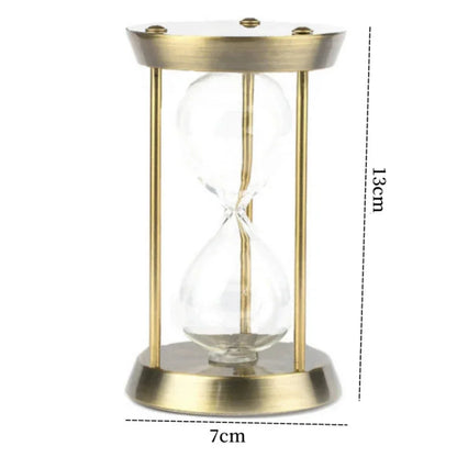 Gold metal hourglass dimension diagram labelled 13 cm high and 7 cm across the base.