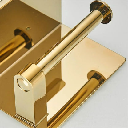 Close-up of a gold-coloured toilet roll holder's spindle, end cap and mounting bracket.