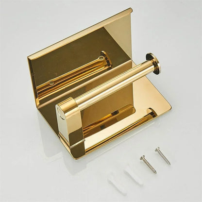 Gold-coloured single toilet roll holder with screws and wall plugs displayed beside it.