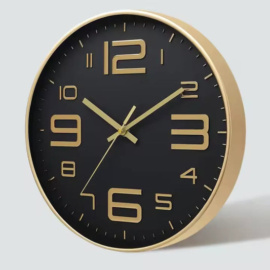 Aurelio Gold & Black 30cm gold wall clock, angled view on the wall