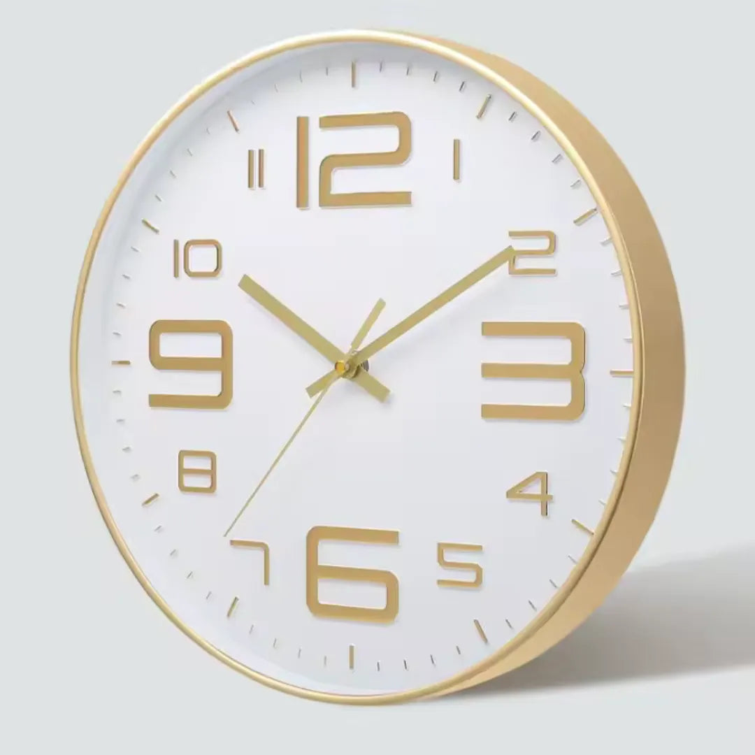 Aurelio Gold & White 30cm gold wall clock, angled view on the wall