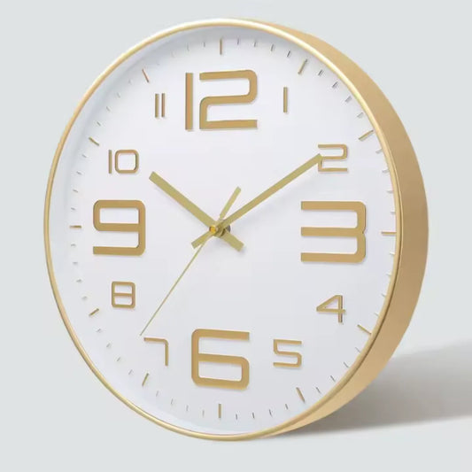 Aurelio Gold & White 30cm gold wall clock, angled view on the wall
