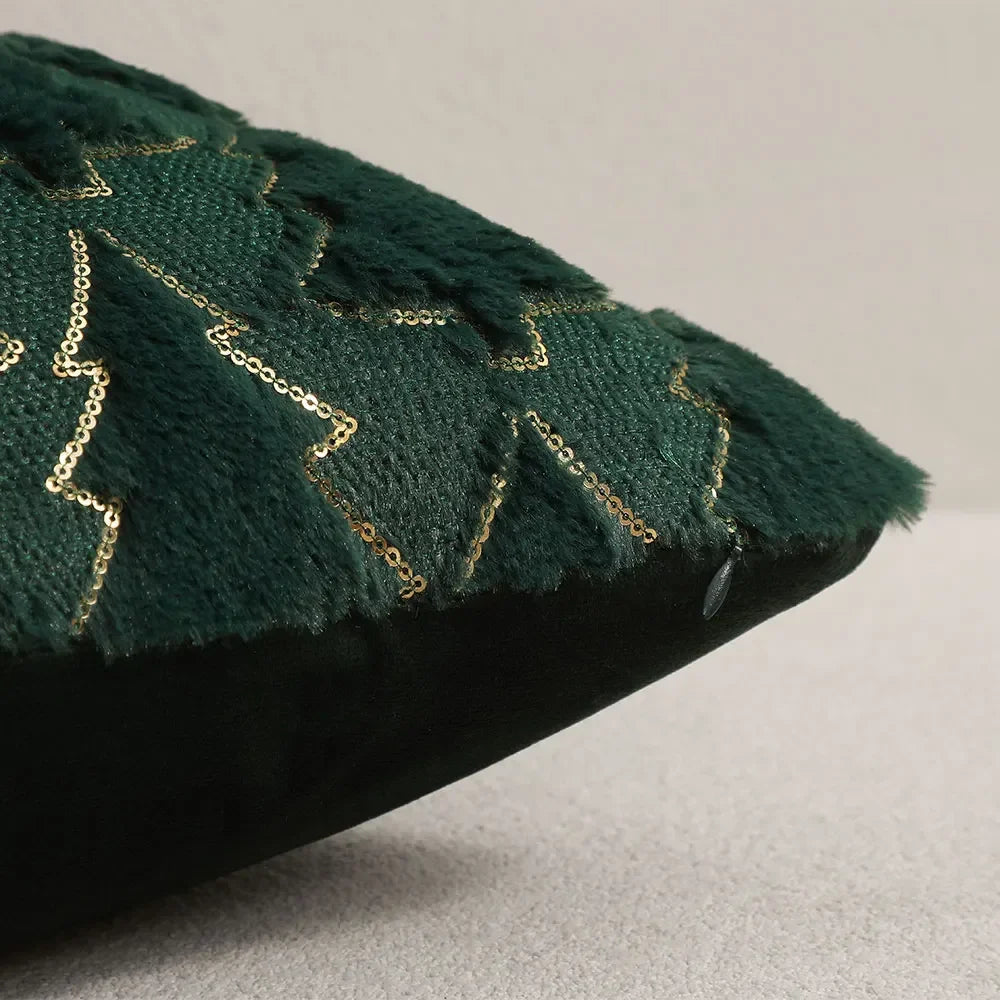 Close-up of the corner and raised plush tree pattern on a dark green Christmas cushion cover