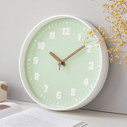 Verona Green 30cm green wall clock, angled view on the wall