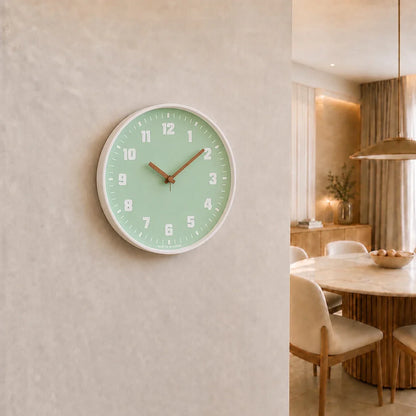 Verona Green 30cm green wall clock, on a dining room wall