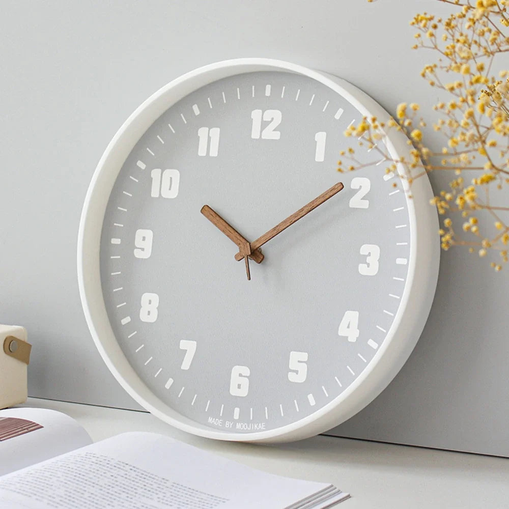 Verona Grey 30cm grey wall clock, angled view on the wall