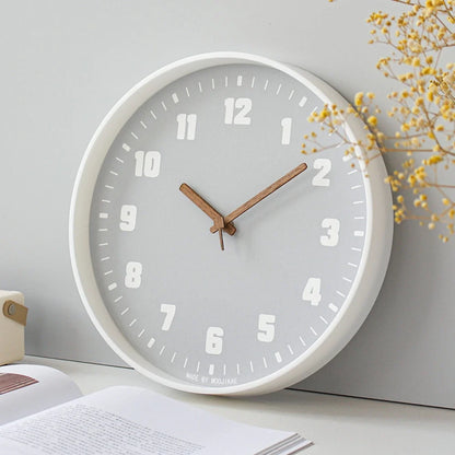 Verona Grey 30cm grey wall clock, angled view on the wall