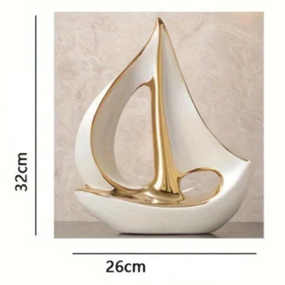 Large white sailboat sculpture with gold-coloured details and a diagram showing 32 cm height and 26 cm width