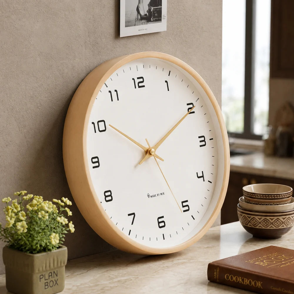 Lorenzzo White & Gold 25cm modern wall clock, angled view on the wall