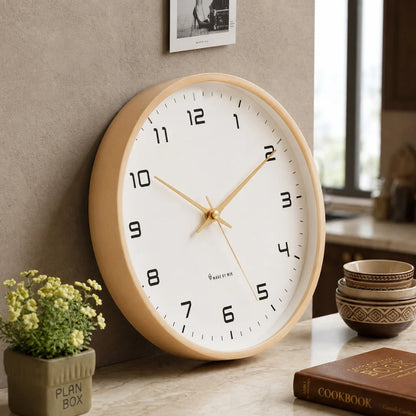 Lorenzzo White & Gold 25cm modern wall clock, angled view on the wall