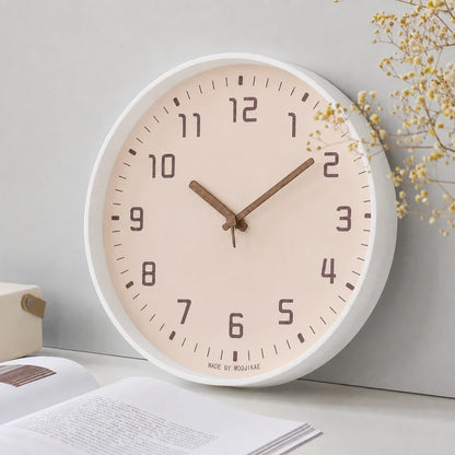 Verona Rose 30cm pink wall clock, angled view on the wall