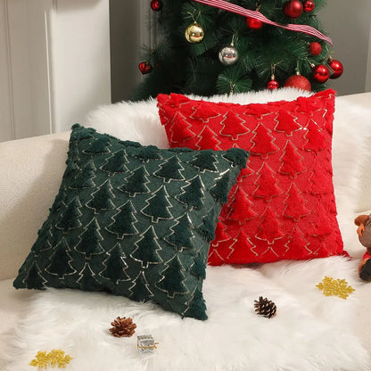 Red and dark green plush Christmas cushion covers with raised tree patterns and gold-coloured outlines