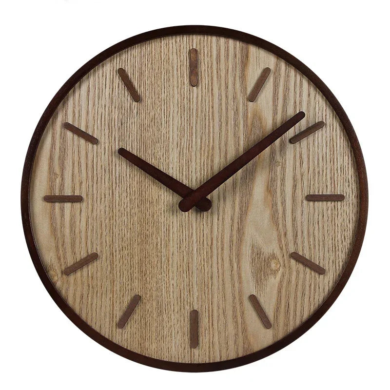 Round wooden wall clock with a light wood-grain face and dark rim, hands and hour markers