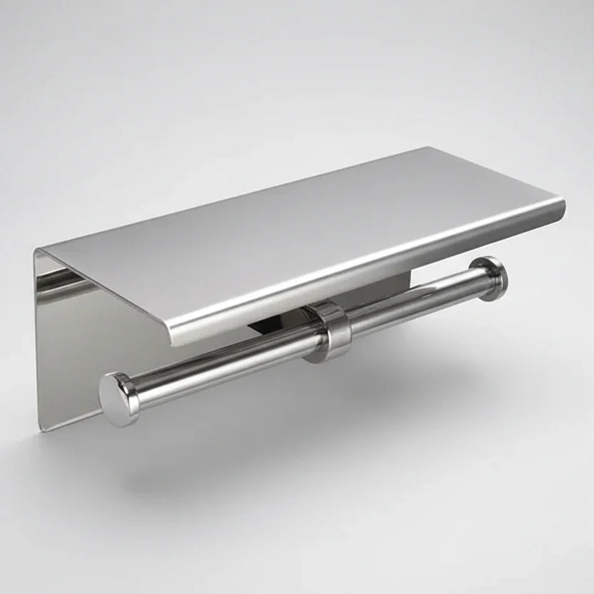 Silver-coloured double toilet roll holder with a rectangular top shelf against a pale background.