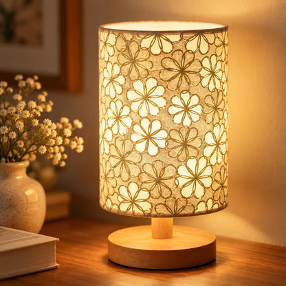 USB powered table lamp with floral shade adding warm bedroom ambience