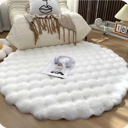 Round white plush rug with a raised grid pattern in front of an armchair, with headphones and a magazine