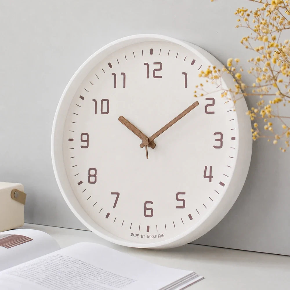Verona White 30cm white wall clock, angled view on the wall