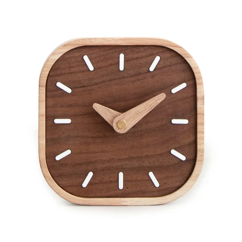 Rounded square desk clock with a dark wooden face, pale hands and white hour markers on a white background