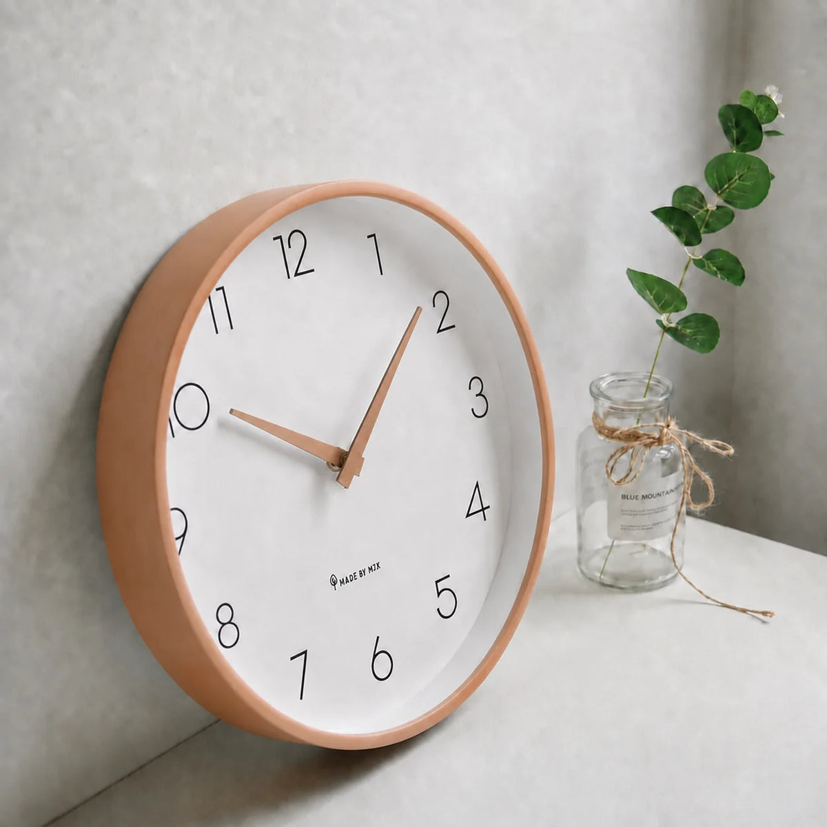 Toscana Beige 26cm wooden wall clock, angled view on the wall